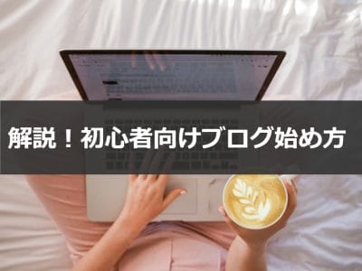 person using MacBook Pro and holding cappuccino